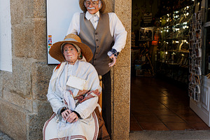 Traditional Galician folk costumes on life sized statues outside a shop in Lugo, a Holiday Photo by Bepslabor