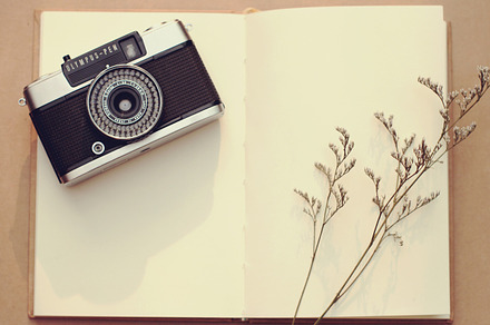 Vintage camera on blank notebook, an Arts & Entertainment Photo by Nuchylee Photo