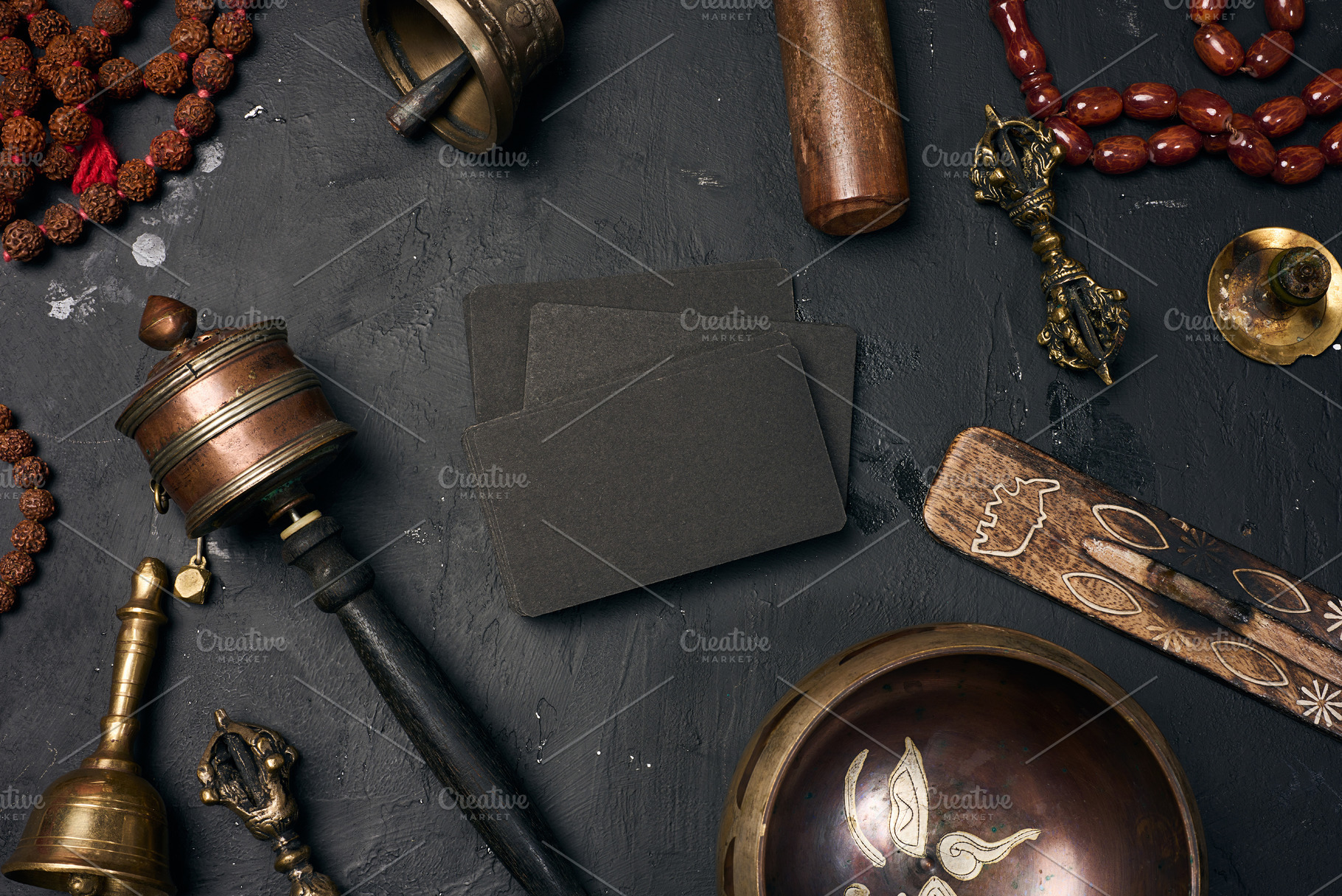 Blank black business cards in the center surrounded by a Tibetan, a Health & Medical Photo by ndanko