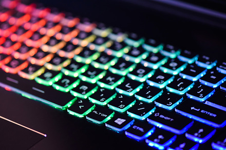 Laptop keyboard with backlight containing red, abstract, and information, a Technology Photo by Sisika