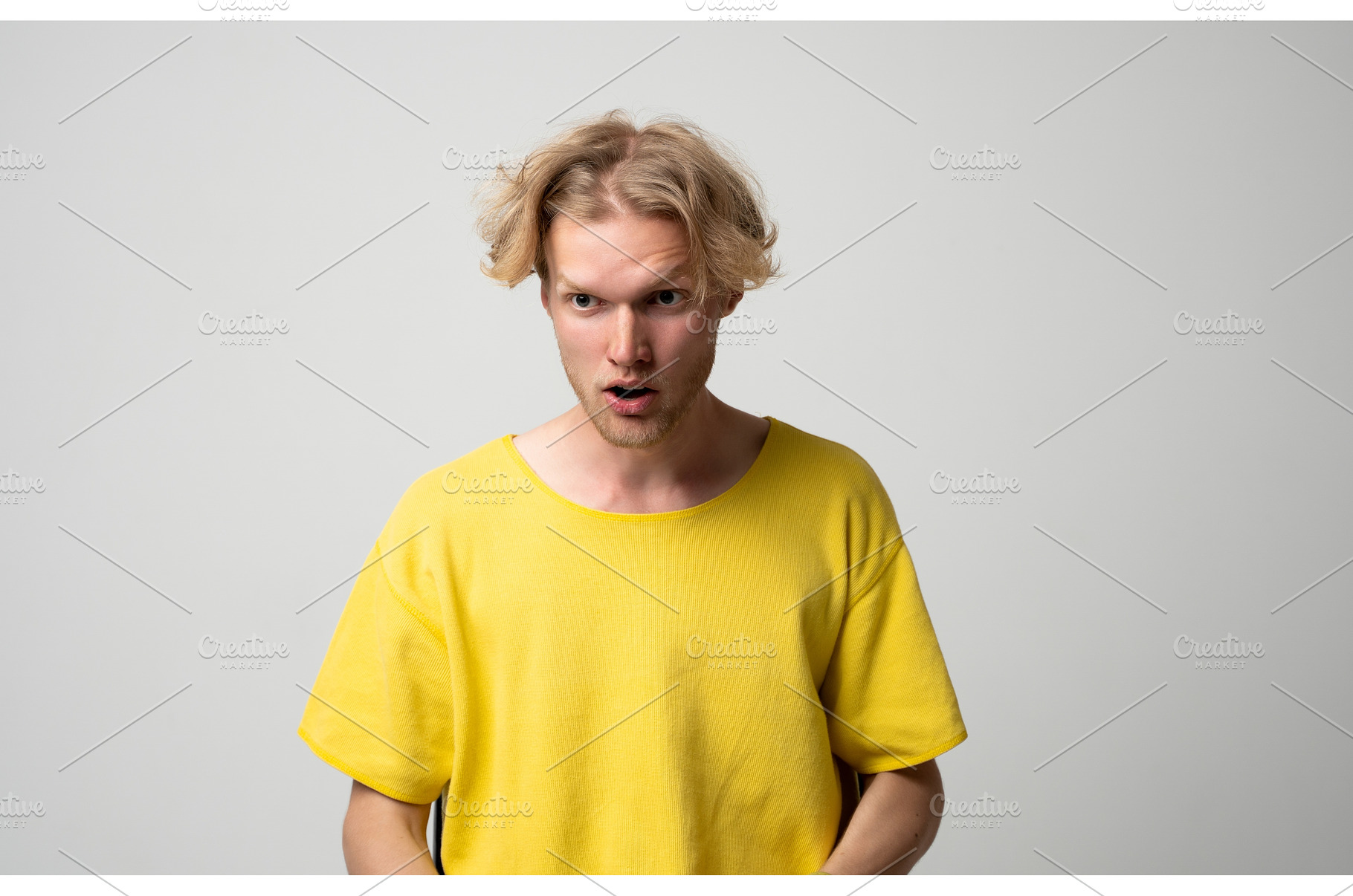 Young man reacting to something, a Person Photo by volodymyrshtun13795