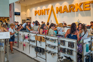 Shoppers inside bright mall under punta market business, a Business Photo by DanFLCreativo