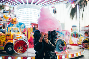 Pretty woman with cotton candy containing person, summer, and food