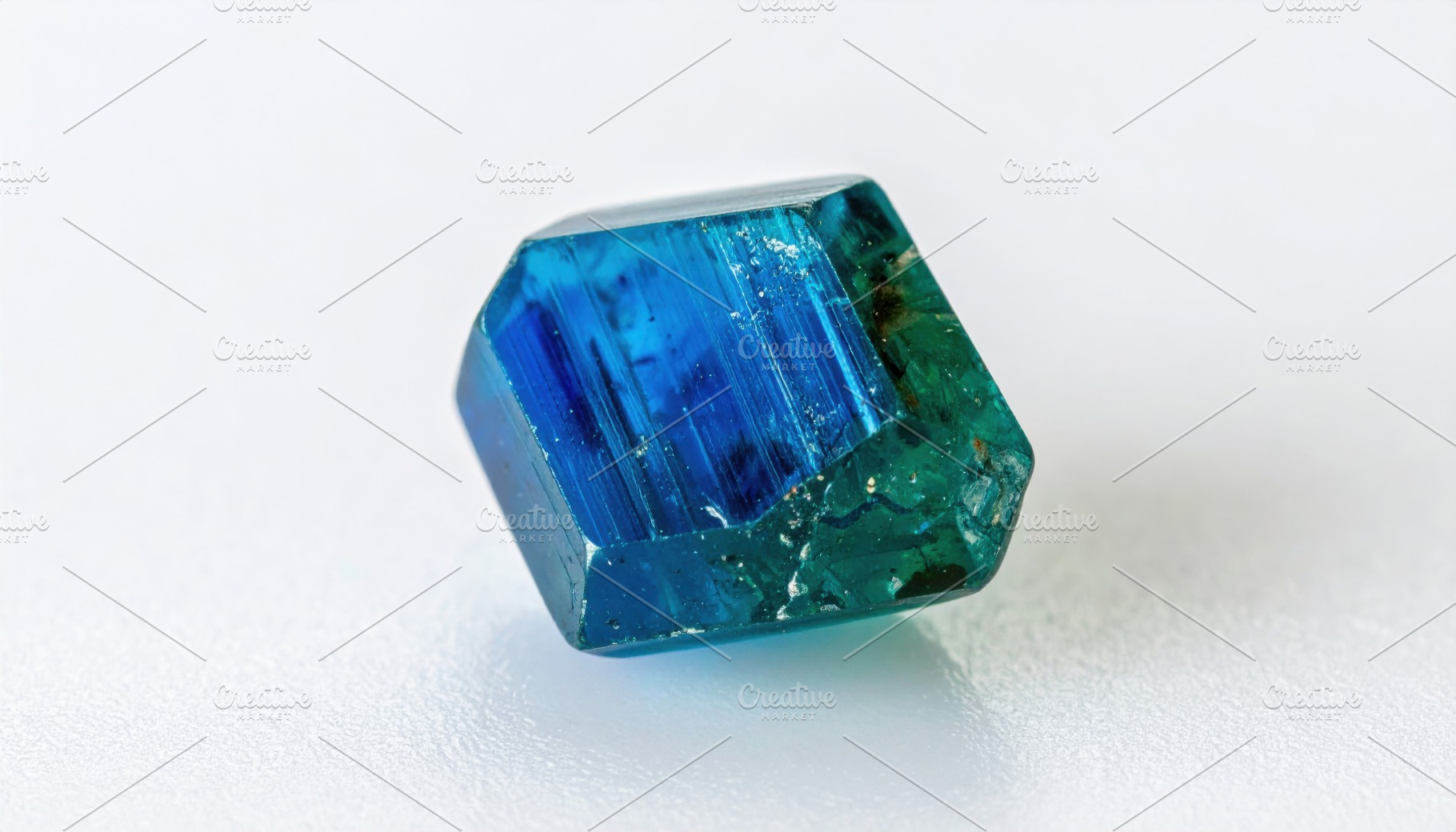 Single tourmaline crystal mineral specimen on white, a Background Photo by Igor Tichonow