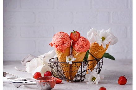 Strawberry ice cream in waffle cone, a Food & Drink Photo by Yulia Furman