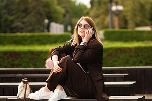 Young woman in brown suit sitting, a Person Photo by Elena Vagengeim
