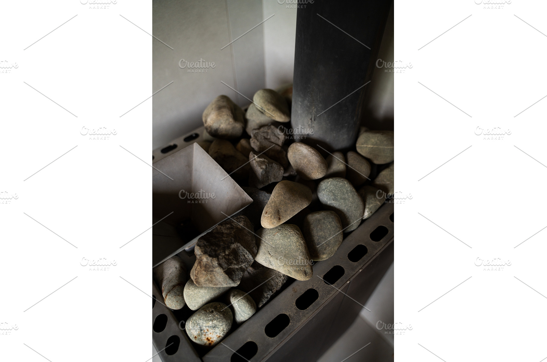 Vertical shot of sauna stones in, a Health & Medical Photo by volodymyrshtun13795