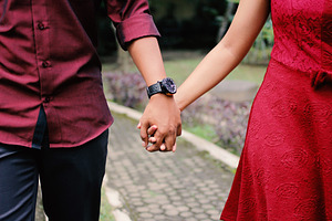 Young couple holding hands