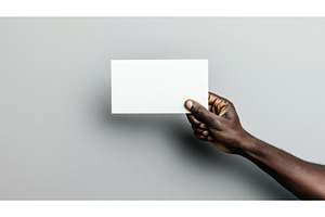 Close-up of a hand holding a blank, a Business Photo by Sergey Kotenev