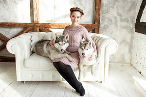 Young beautiful pregnant woman with husky stock photo containing woman and