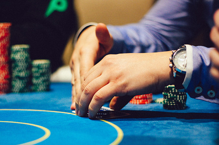 Poker player viewing cards