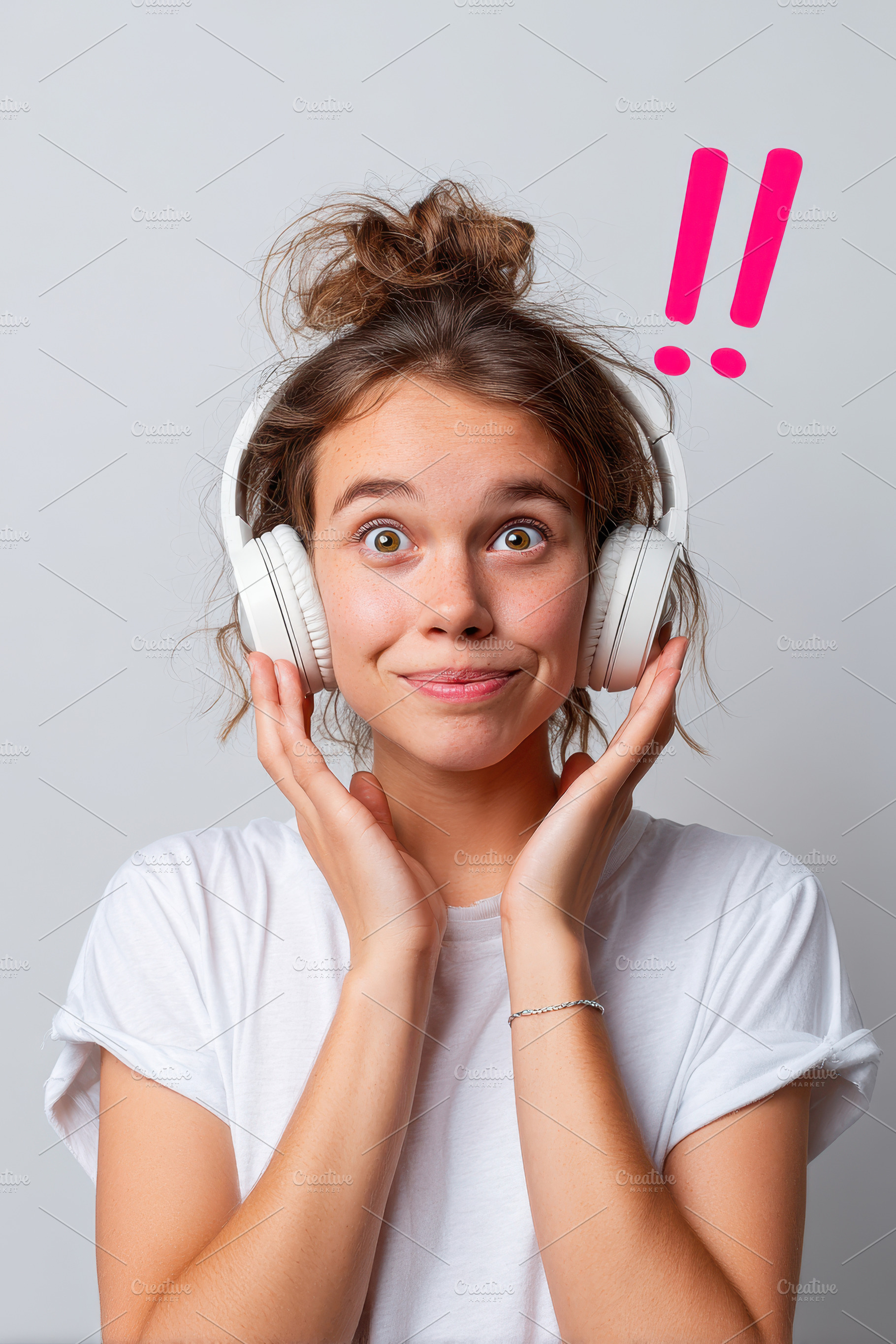 Surprised young woman with headphones, a Person Photo by AlyaAnd