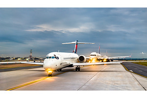 Airplanes lined up for takeoff at containing airplane, travel, and airport, a Transportation Photo by Leonid Andronov