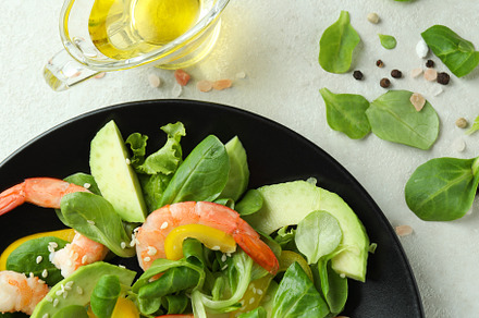 Concept of tasty eating with shrimp salad, a Food & Drink Photo by AtlasStudio PRO