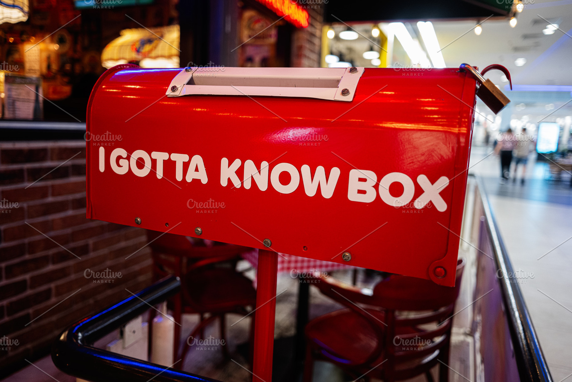 Red mailbox with I gotta know box text, mall environment, a Photo by AS photostudio