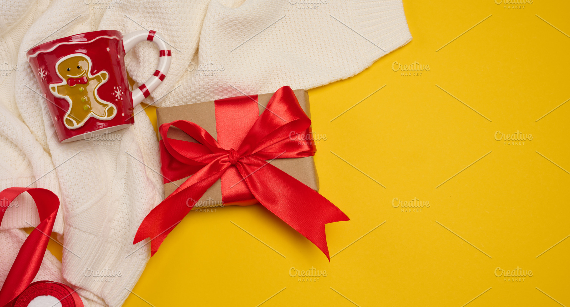 Christmas composition: two gift boxes with red bows, a mug and a, a Holiday Photo by ndanko