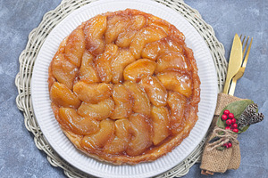 Apple Taret Tatin on plate, french upside down cake, horizontal top view, a Food & Drink Photo by iuliia_n