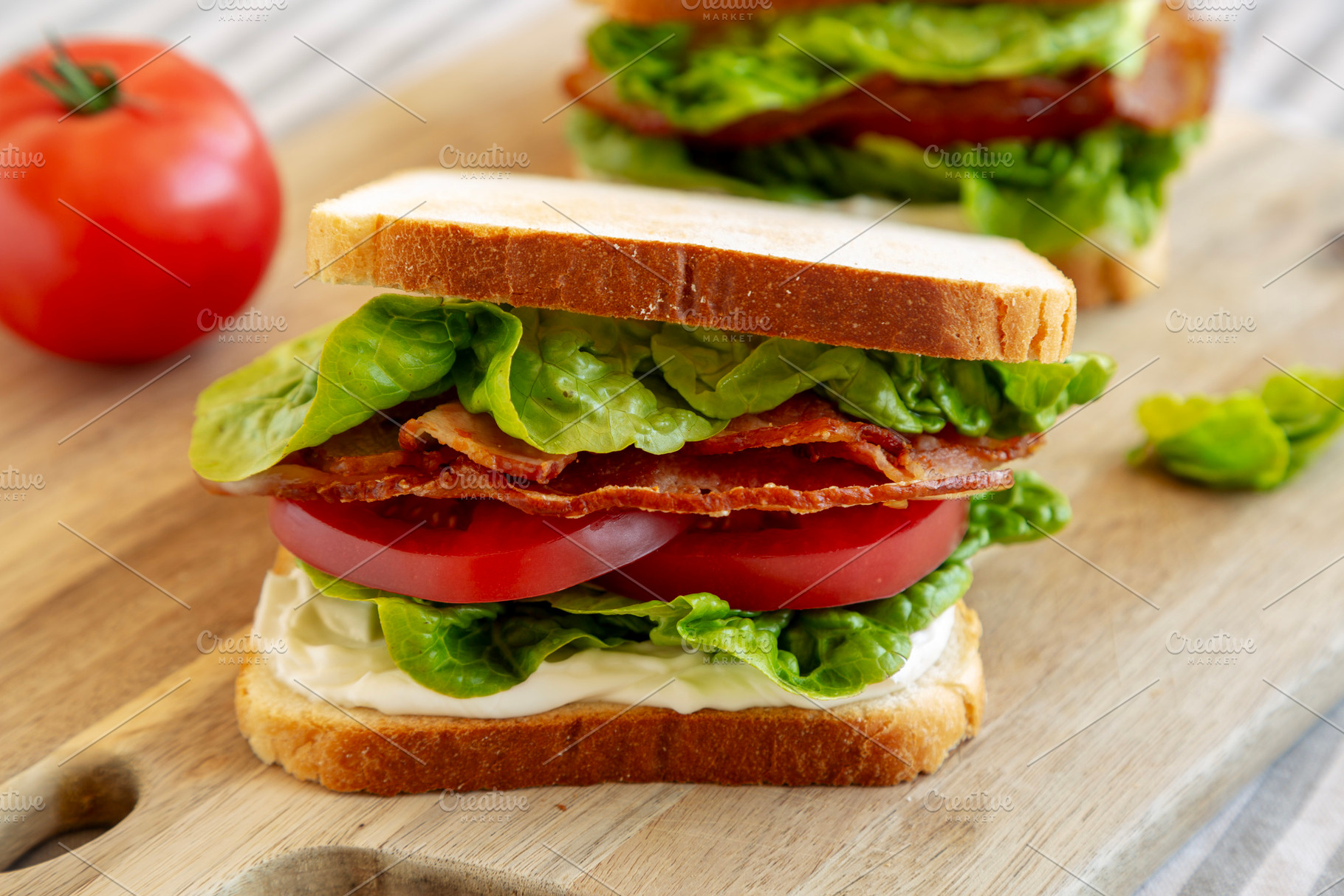 Homemade BLT (Bacon Lettuce Tomato) Sandwich with Mayo, side vie, a Food & Drink Photo by LiudmylaChuhunova