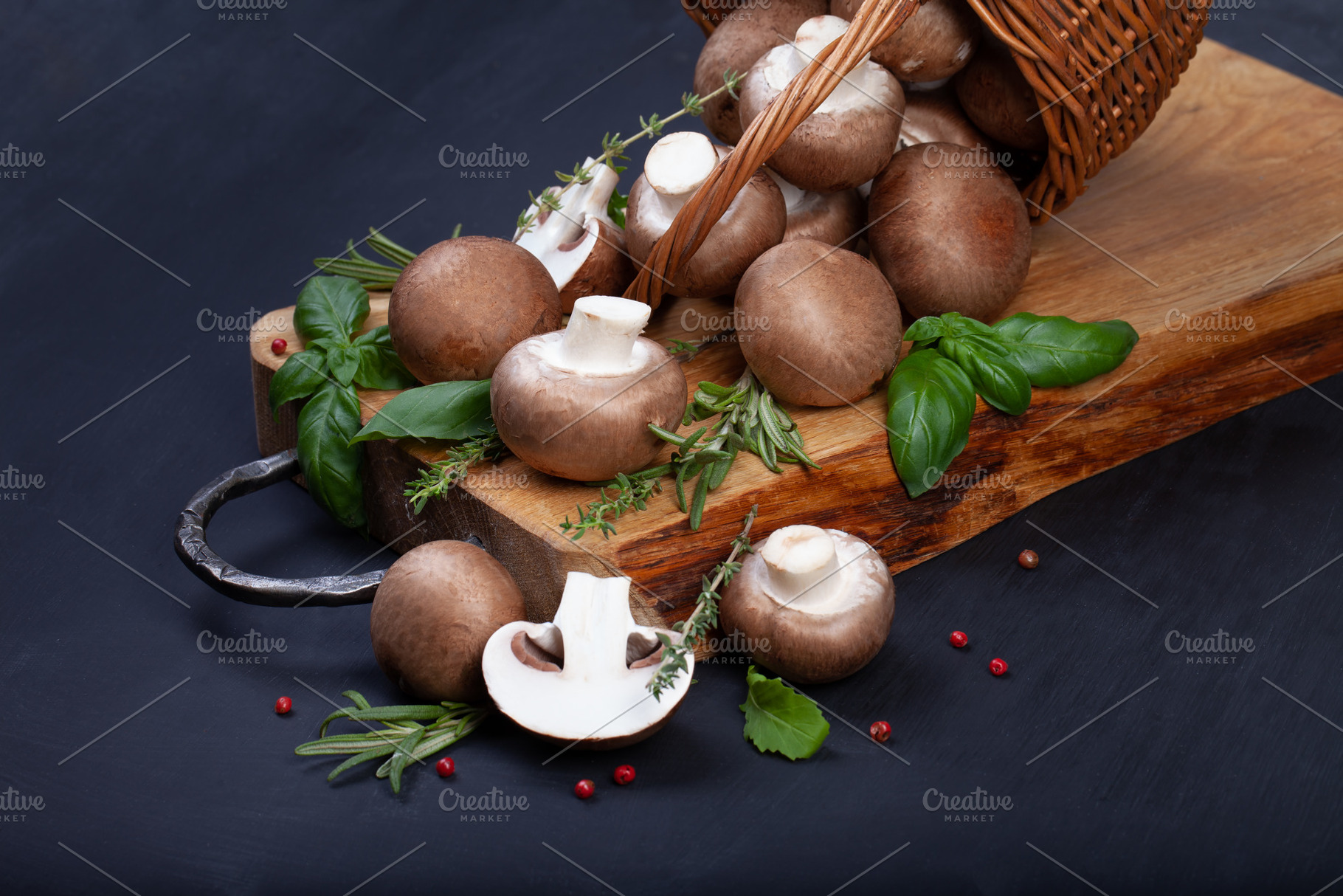 Fresh champignon mushrooms on dark wooden table, a Food & Drink Photo by eleana