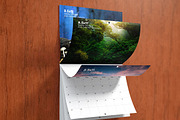 Saddle Stitched Wall Calendar Mockup, a Mockup by Vectogravic Design (Thumbnail 2 of 7)