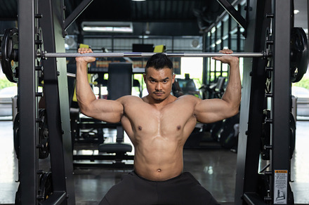 A  Man Pumping Up Muscles