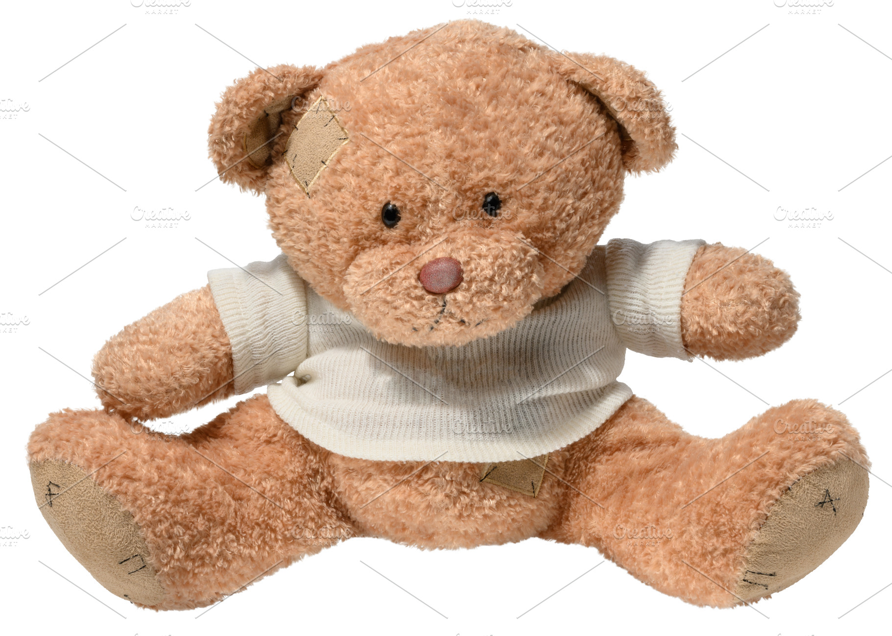 Brown teddy bear in white sweater on isolated background, a School & Education Photo by ndanko