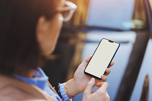Woman's hands holding mobile phone stock photo containing display and media