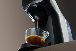 Capsule coffee maker preparing espresso on bench bottom view, a Food & Drink Photo by Davizro's Market