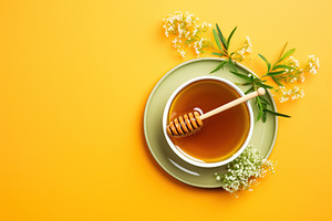 Honey in bowl on yellow background, a Food & Drink Photo by AlyaAnd