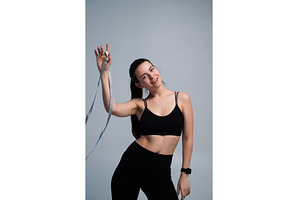 Woman standing against a gray, a Sports & Recreation Photo by volodymyrshtun13795