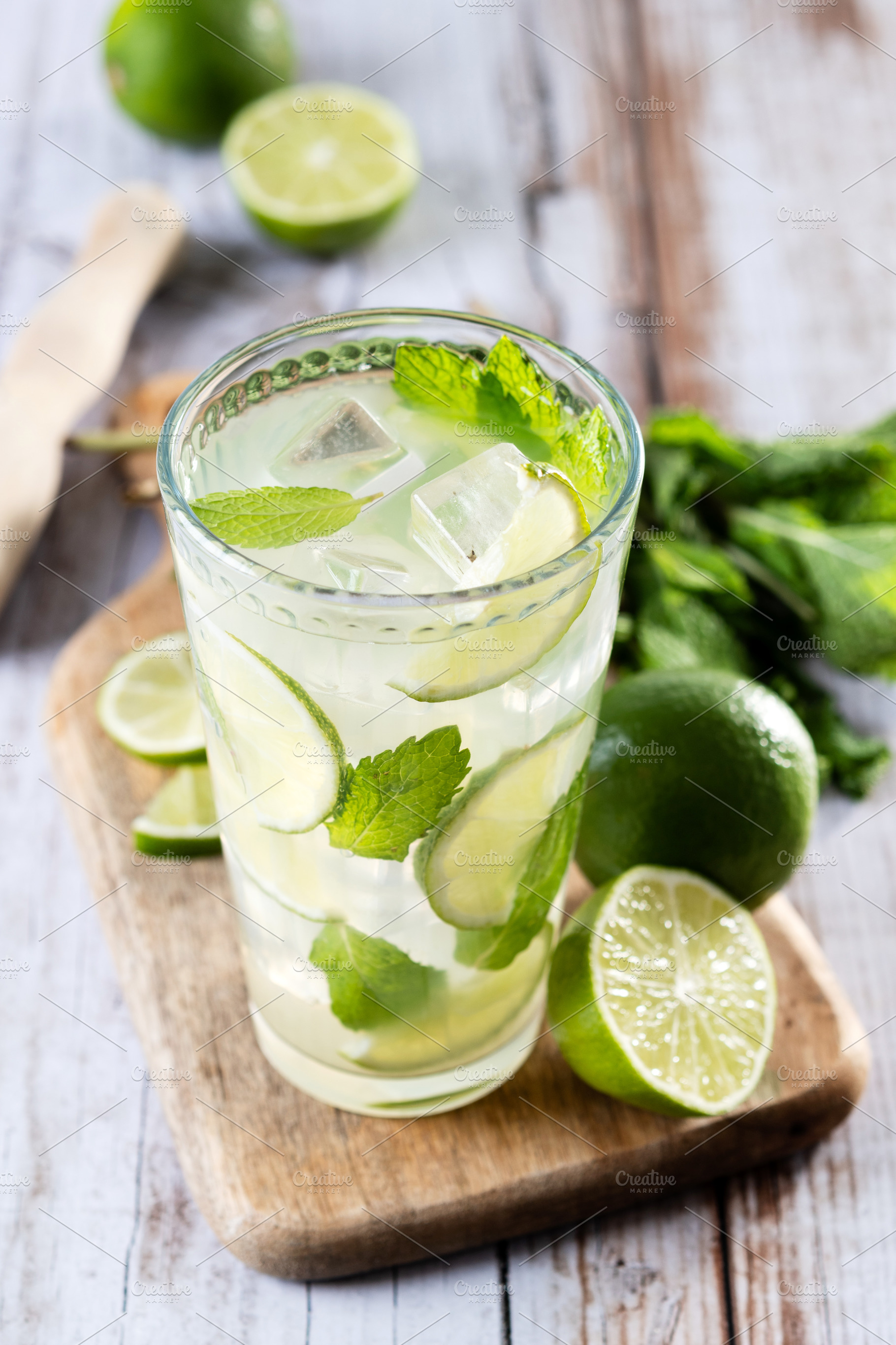 Fresh mojito cocktail with lime, mint and ice in glass, a Food & Drink Photo by etorres69