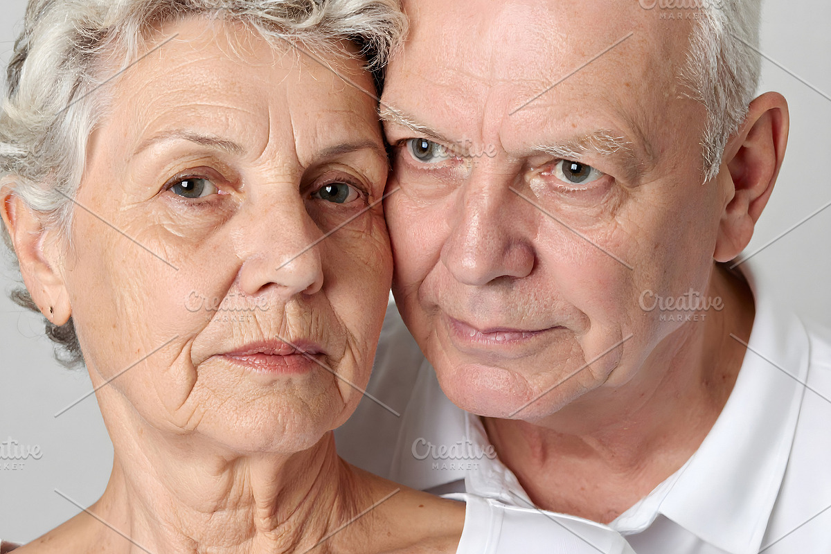 Senior couple portrait with calm expressions and white shirts, a Person Photo by GoodGoods (Photo 1 of 2)