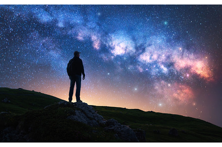 Glowing Milky Way and man on