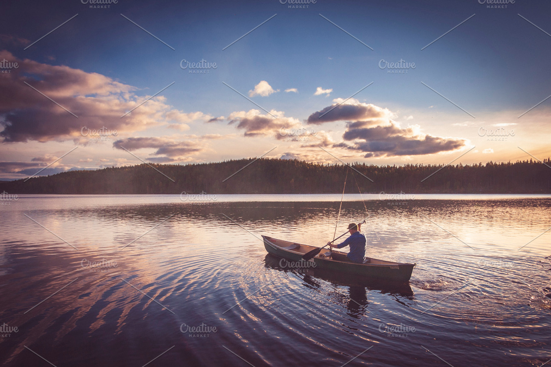 Fisherman On Lake Before Dusk