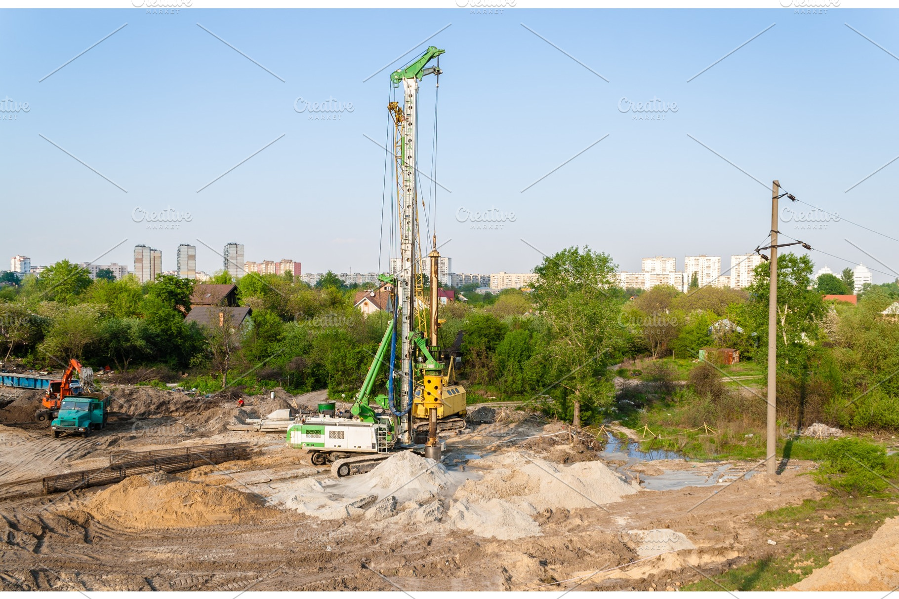 Pile driver at a construction site stock photo containing pile and ukraine, an Industrial Photo by Leonid Andronov