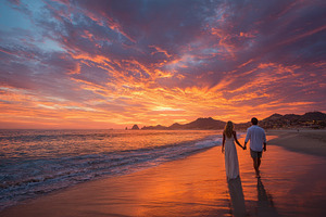 Couple holding hands walking beach s, a Photo by Pixeness Studio