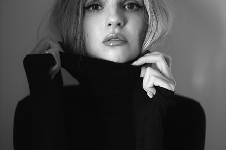 Close up portrait of a woman with pink hair and a black sweater on background i, a Person Photo by SaulichPhoto