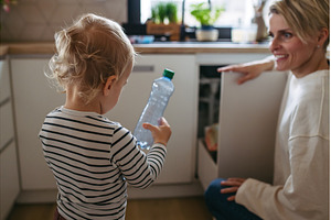 Mother teaching toddler to sort, a Person Photo by HalfPoint