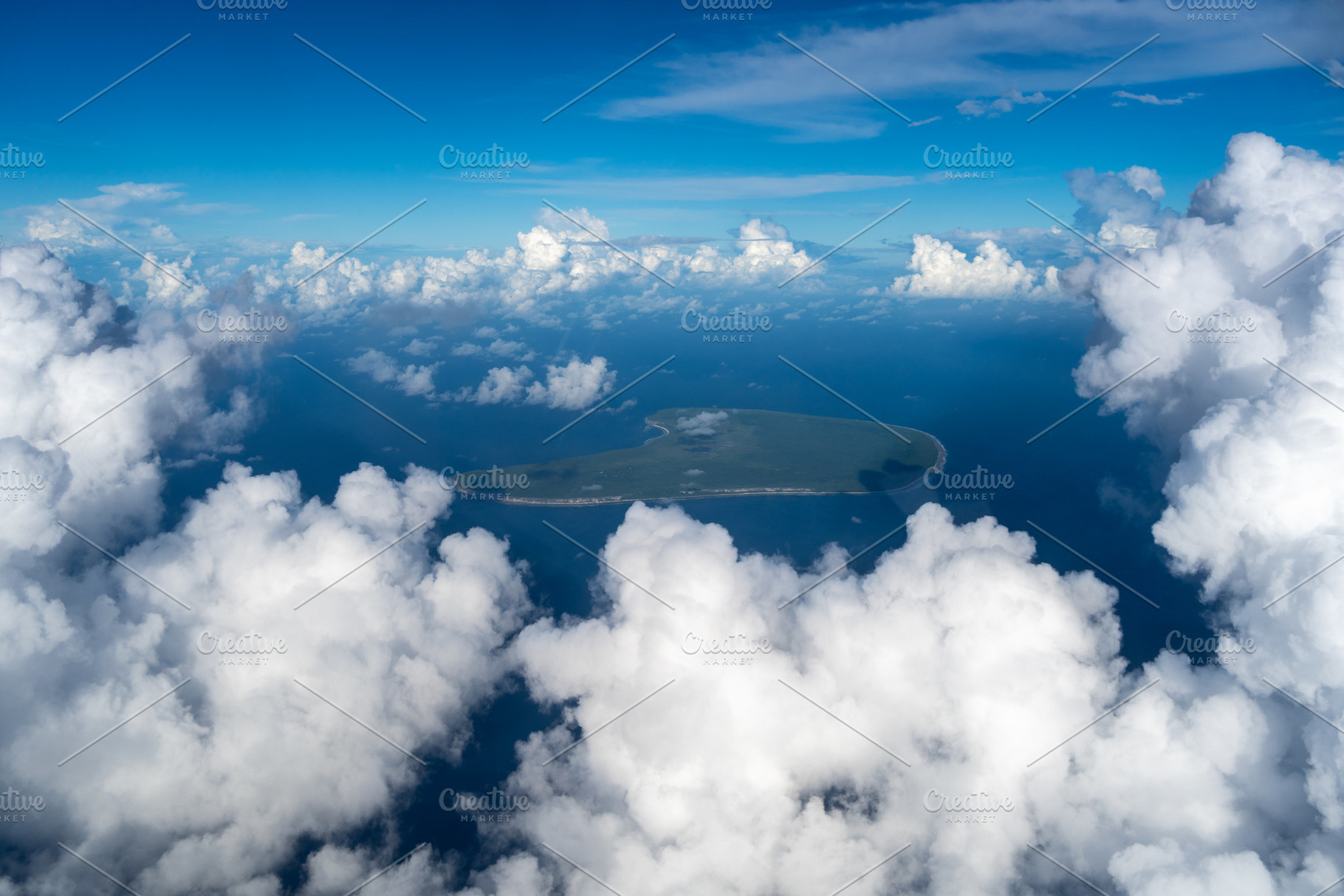 Aerial view of Makatea Island surrounded by clouds in French Pol, a Nature Photo by GoodGoods