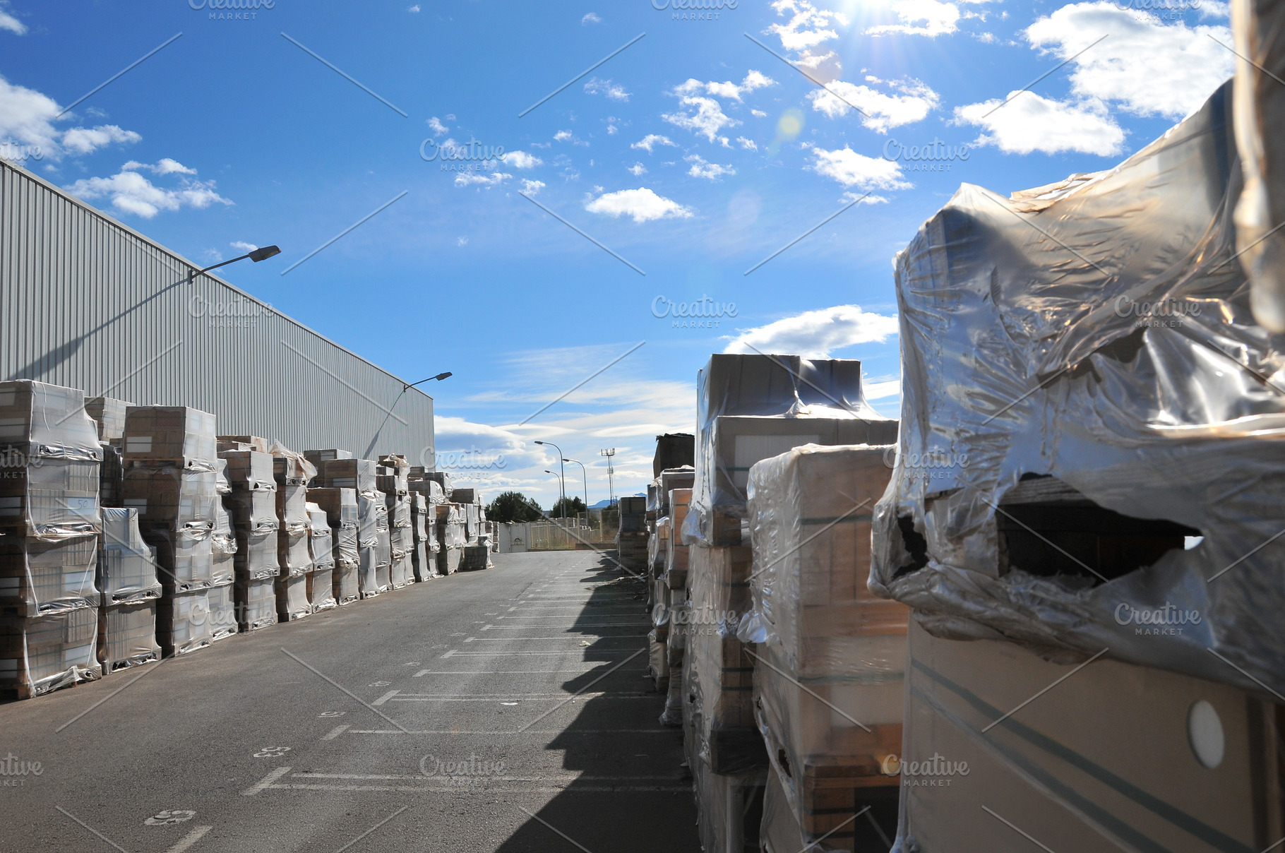 Ceramic Tile Pallets Stored Outdoors at Industrial Warehouse, an Industrial Photo by Davizro's Market