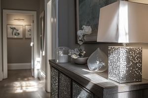 Elegant entrance hall displaying a decorative console table with a modern lamp, an Architecture Photo by Studio ANNA