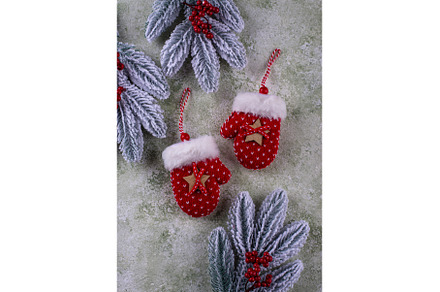 Festive mittens adorning snowy, a Holiday Photo by Yulia Furman