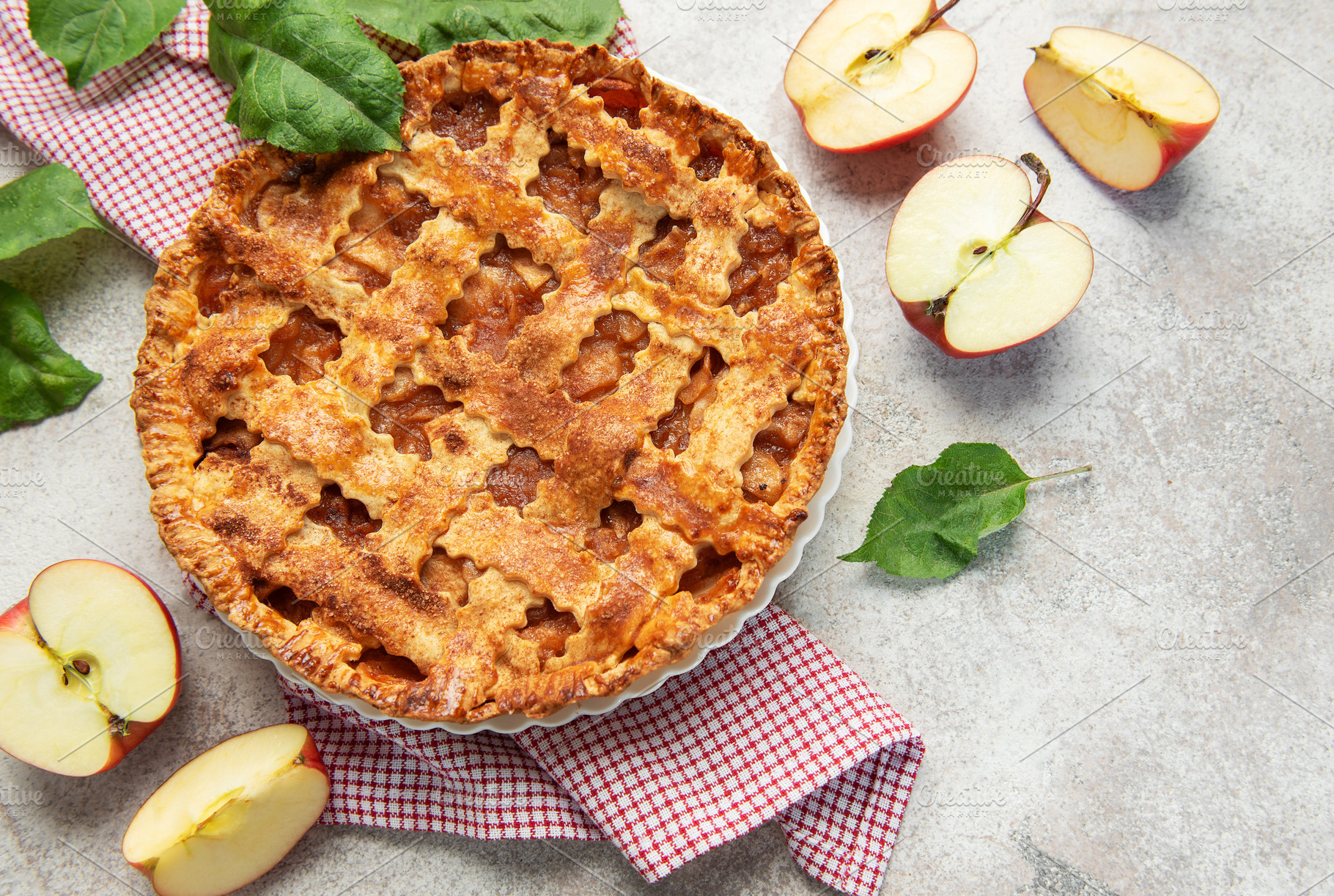 Freshly baked apple pie with lattice crust and sliced apples, a Food & Drink Photo by Olena Rudo