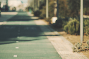 Bike lane symbol on empty city path, an Industrial Photo by SkyNext
