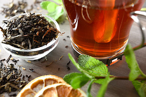 Macro detail of bowl with black tea leaves and drink, a Food & Drink Photo by Davizro's Market