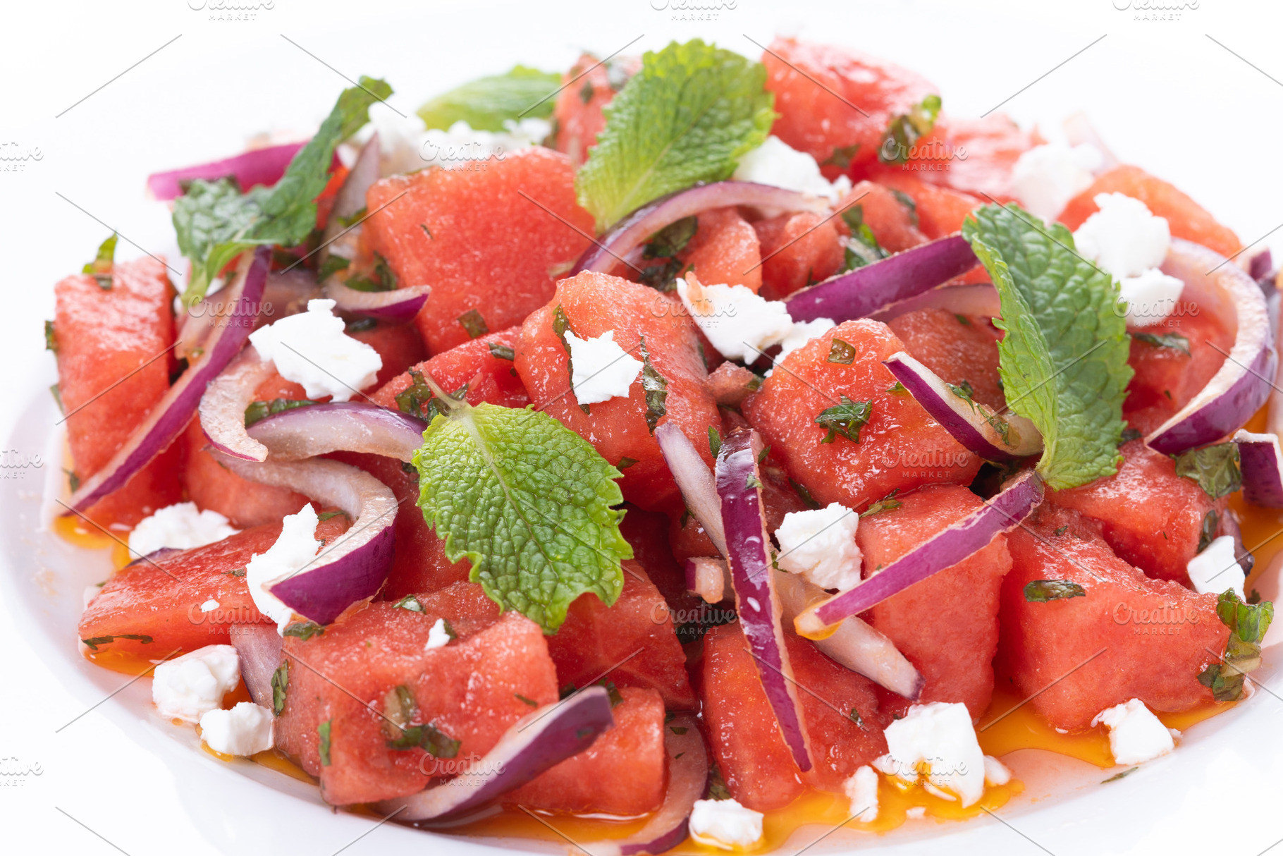 Fresh Watermelon Feta Salad with Mint and Red Onion isolated on white backgroun, a Food & Drink Photo by etorres69