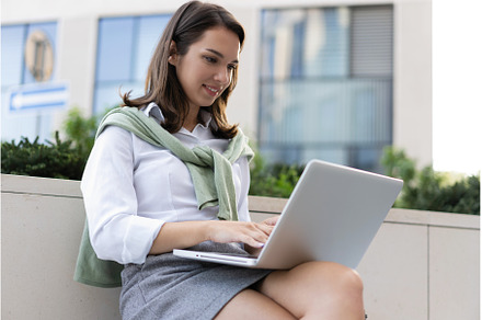 business woman working on laptop, a Person Photo by OPOLJA