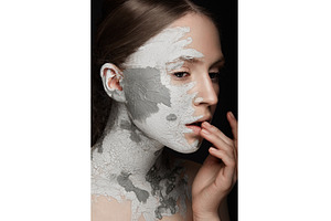 Beautiful girl with mud on his face