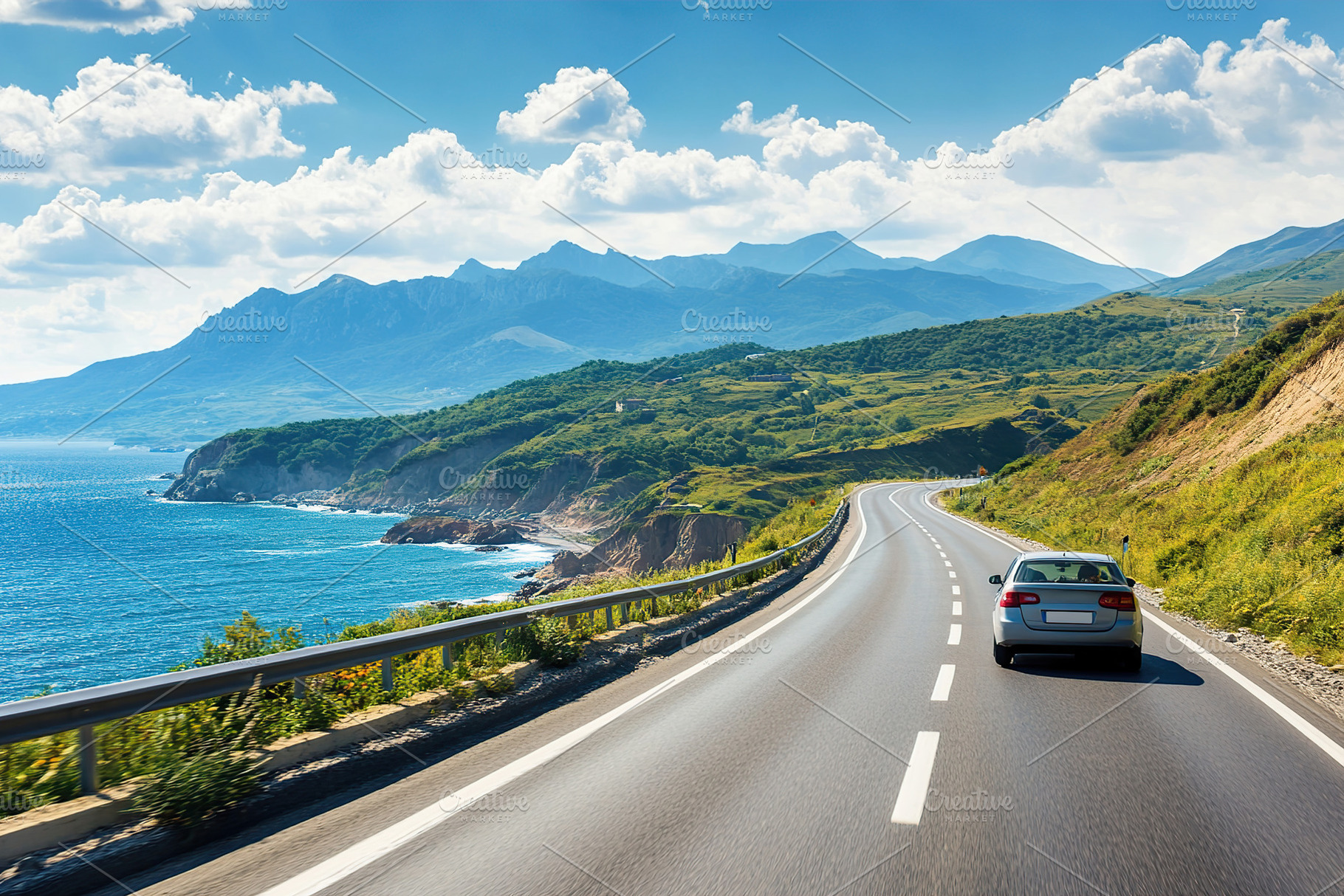 Driving along a scenic highway with mountains and ocean views on a beautiful da, a Transportation Photo by AlyaAnd