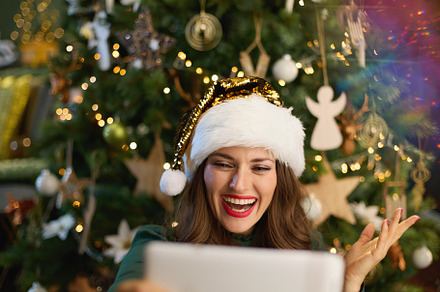 smiling modern woman having video call in modern house, a Person Photo by Alliance Images